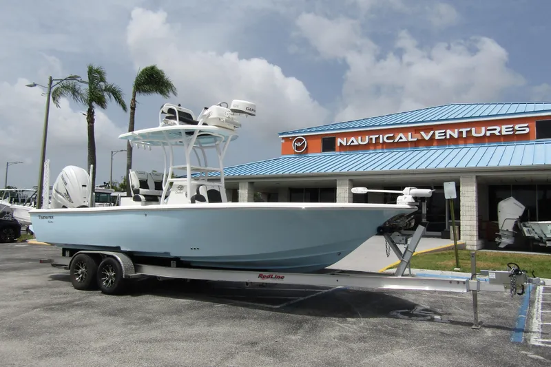 Slide: The Image of 2021 Tidewater 2700 Carolina Bay boat on trailer at Nautical Ventures dealership. - 5