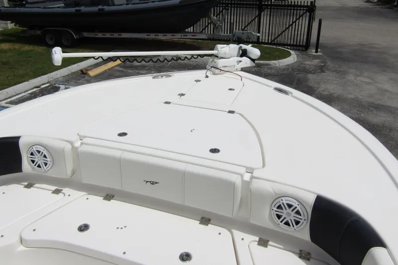 Slide: The Image of 2021 Tidewater 2700 Carolina Bay boat deck with speakers and trolling motor. - 9