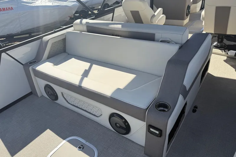 Slide: The Image of Luxury seating on 2026 Alera M 25L boat with integrated speakers and cup holders. - 9