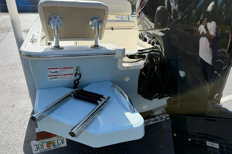 Slide: The Image of 2025 Boston Whaler 170 Montauk boat with motor and swim platform. - 11
