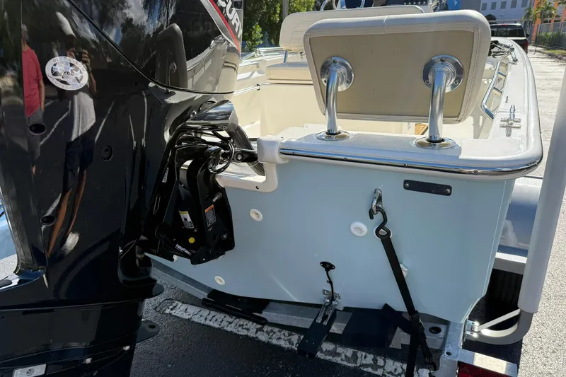 Slide: The Image of 2025 Boston Whaler 170 Montauk boat with Mercury engine, rear view. - 13