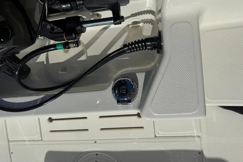 Slide: The Image of 2025 Boston Whaler 170 Montauk boat deck with control cables and fittings. - 20