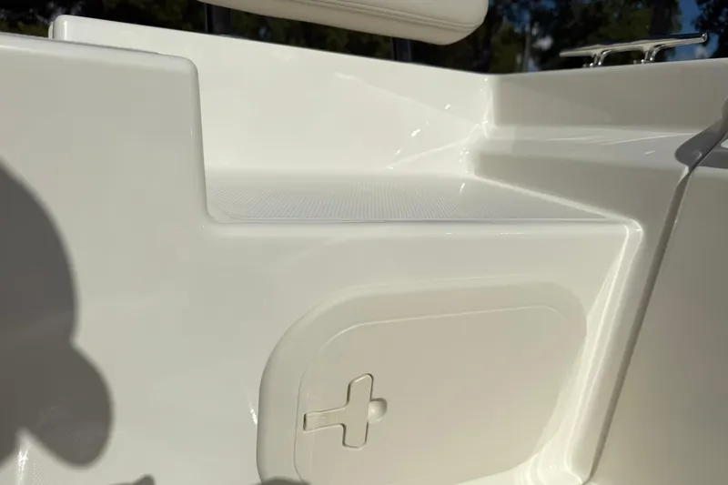 Slide: The Image of 2025 Boston Whaler 170 Montauk boat interior detail, featuring sleek white design. - 23