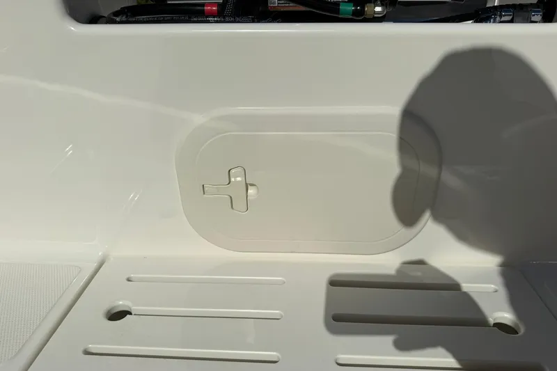 Slide: The Image of 2025 Boston Whaler 170 Montauk boat interior detail with storage compartment. - 24