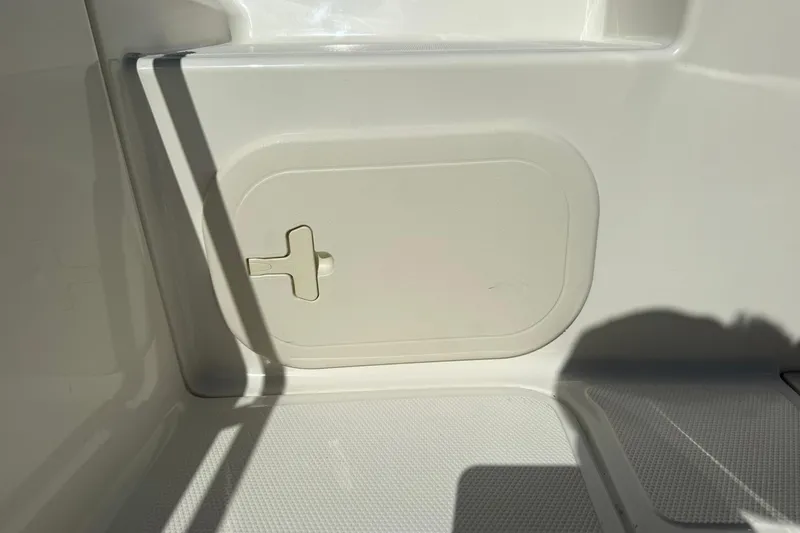 Slide: The Image of 2025 Boston Whaler 170 Montauk interior storage compartment detail. - 25