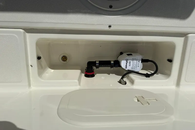 Slide: The Image of 2025 Boston Whaler 170 Montauk boat compartment with pump and wiring. - 30