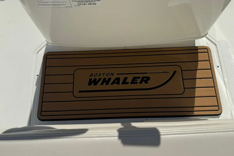 Slide: The Image of 2025 Boston Whaler 170 Montauk boat deck with branded mat. - 34