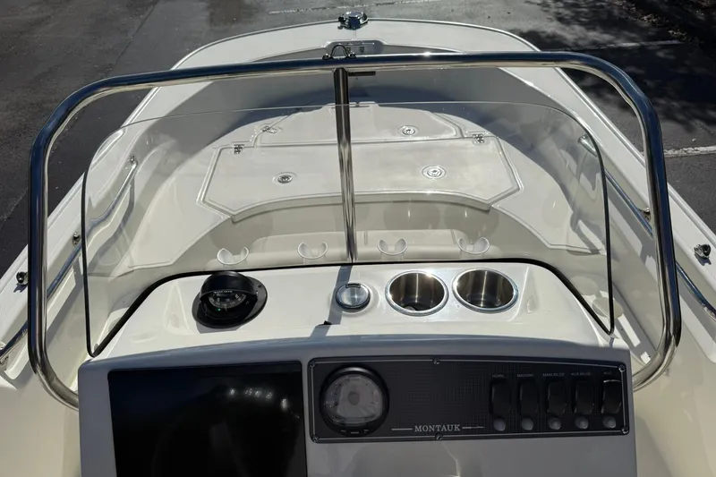 Slide: The Image of 2025 Boston Whaler 170 Montauk boat console with steering and controls. - 35
