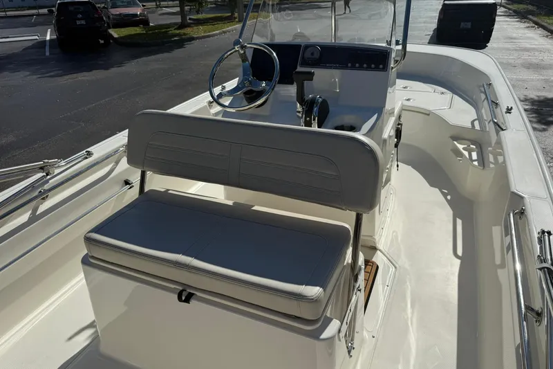 Slide: The Image of 2025 Boston Whaler 170 Montauk boat interior with steering console and seating. - 41