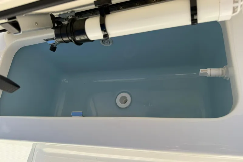 Slide: The Image of Livewell tank in 2025 Boston Whaler 170 Montauk boat, featuring plumbing components. - 44