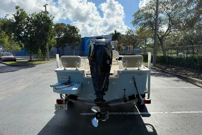 Slide: The Image of 2025 Boston Whaler 170 Montauk boat parked outdoors under a sunny sky. - 5
