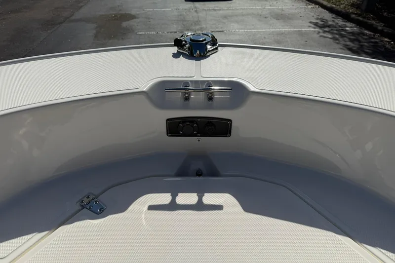 Slide: The Image of 2025 Boston Whaler 170 Montauk boat interior, showcasing bow area and deck details. - 53