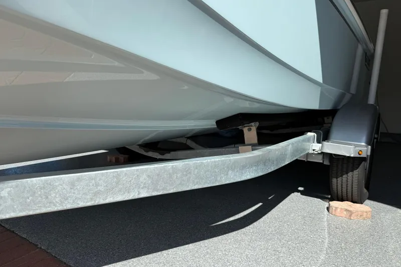 Slide: The Image of 2025 Boston Whaler 170 Montauk boat on trailer, close-up view. - 65