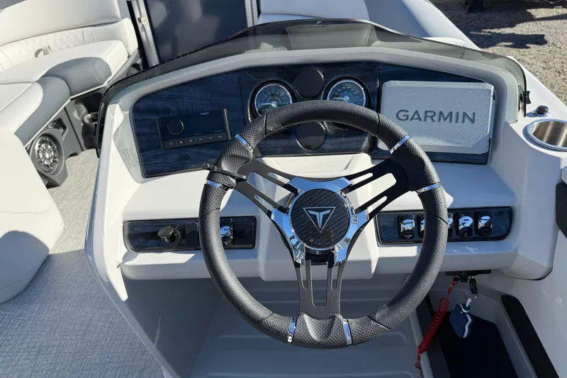 Slide: The Image of 2026 Tahoe Pontoon LTZ Quad Lounger Shift dashboard with Garmin navigation system. - 3
