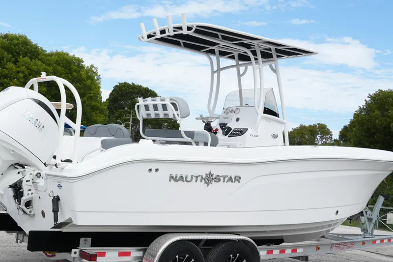Slide: The Image of 2025 NauticStar 222 Offshore boat on trailer, featuring sleek design and modern features. - 5