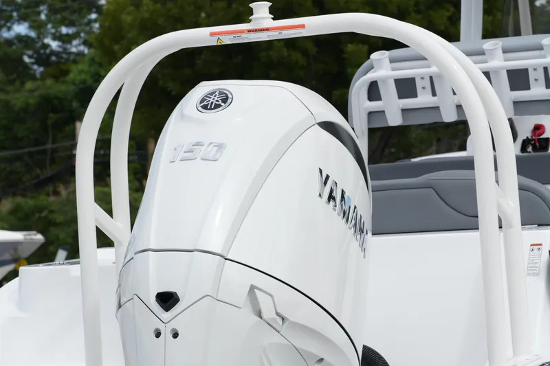 Slide: The Image of 2025 NauticStar 222 Offshore with Yamaha 150 outboard motor, rear view. - 8
