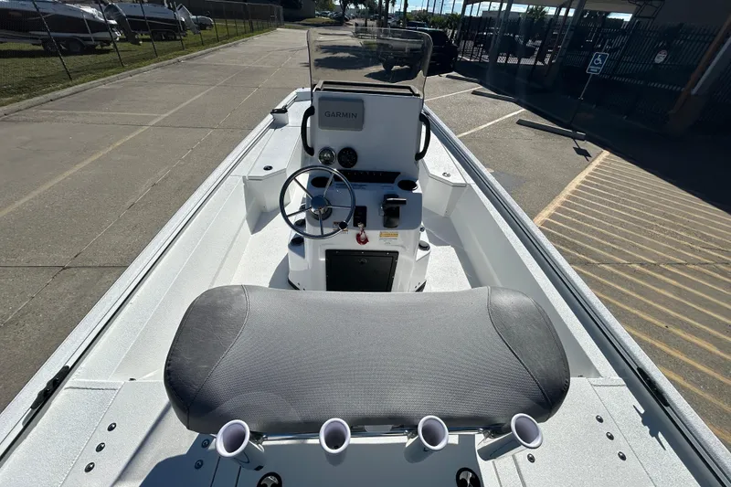 Slide: The Image of Avid 21 Recon ST 2026 boat interior with steering console and seating. - 10