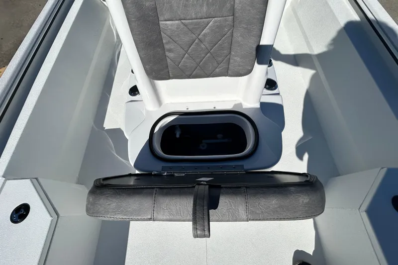 Slide: The Image of Interior view of 2026 Avid 21 Recon ST boat with seating and storage compartment. - 18