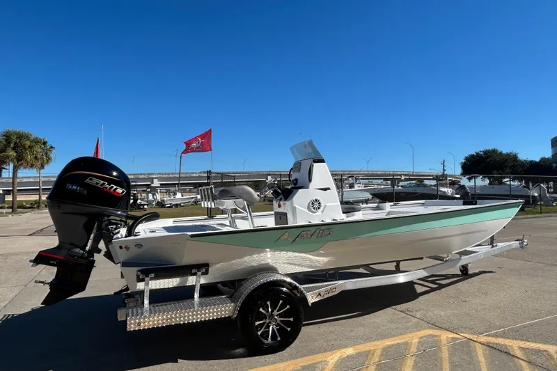 Slide: The Image of 2026 Avid 21 Recon ST boat on trailer, featuring Yamaha outboard motor. - 5