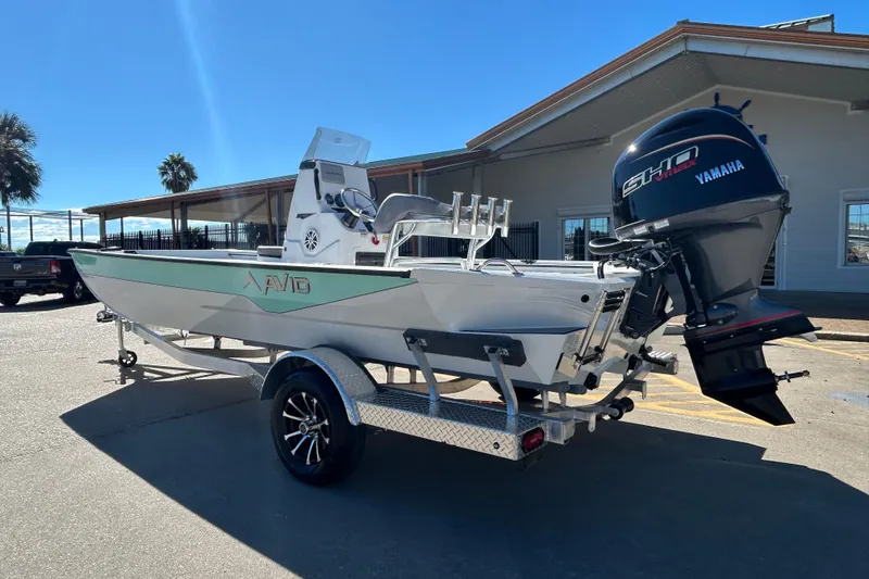 Slide: The Image of Avid 21 Recon ST 2026 boat with Yamaha engine on trailer, outdoors. - 7