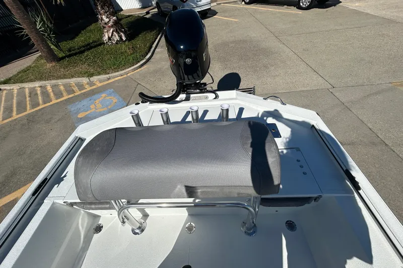 Slide: The Image of Avid 21 Recon ST 2026 boat with seating and motor in a parking lot. - 8