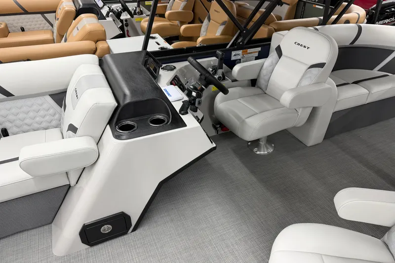 Slide: The Image of Interior of 2025 Crest Classic 200 boat with modern seating and steering console. - 5