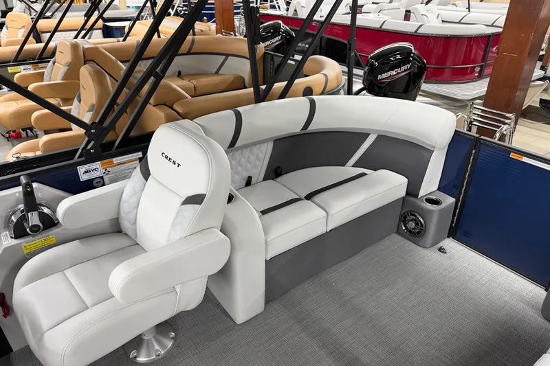 Slide: The Image of 2025 Crest Classic 200 boat interior with white seating and modern design. - 8