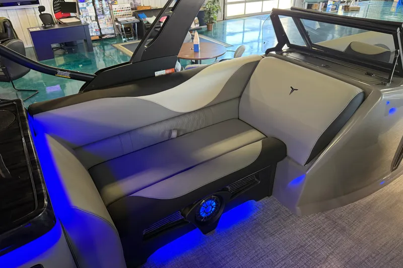 Slide: The Image of 2026 Tahoe Pontoon LTZ Elite Windshield interior with sleek seating and ambient blue lighting. - 3