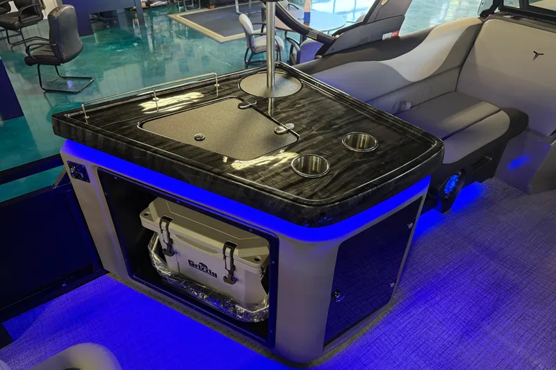 Slide: The Image of 2026 Tahoe Pontoon LTZ Elite Windshield interior with sleek bar area and ambient lighting. - 4