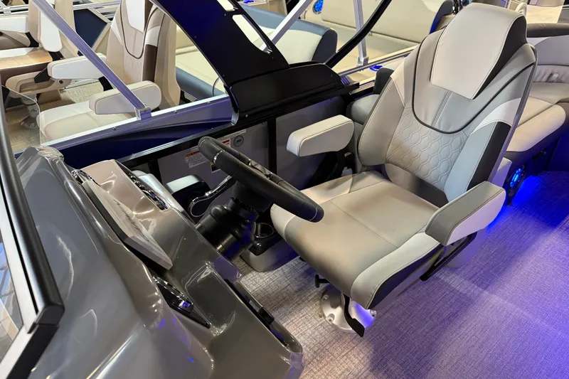 Slide: The Image of 2026 Tahoe Pontoon LTZ Elite Windshield captain's chair and helm, featuring modern design. - 7