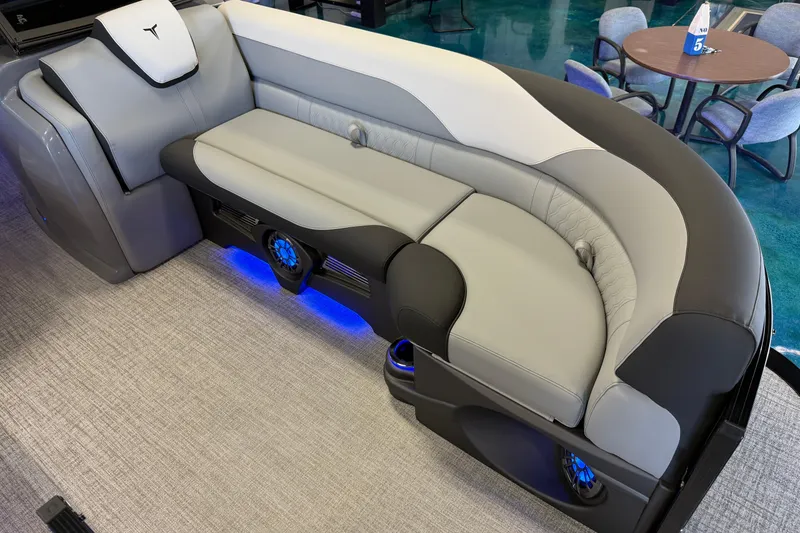 Slide: The Image of 2026 Tahoe Pontoon LTZ Elite Windshield interior with stylish seating and blue LED lighting. - 9