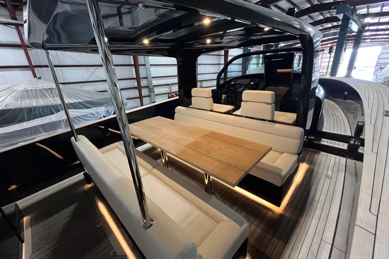 Slide: The Image of Luxurious 2018 Alen 45 yacht interior with elegant seating and wooden table in a spacious cabin. - 15
