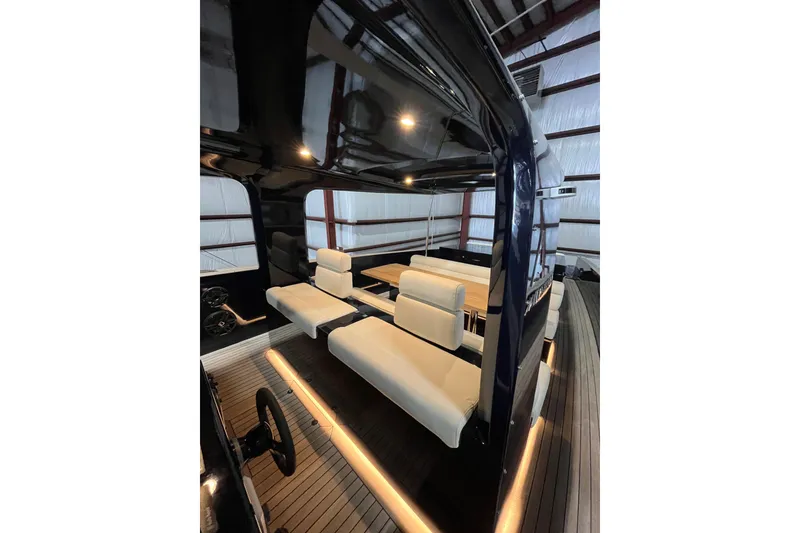 Slide: The Image of Luxurious interior of 2018 Alen 45 yacht with sleek seating and ambient lighting. - 18