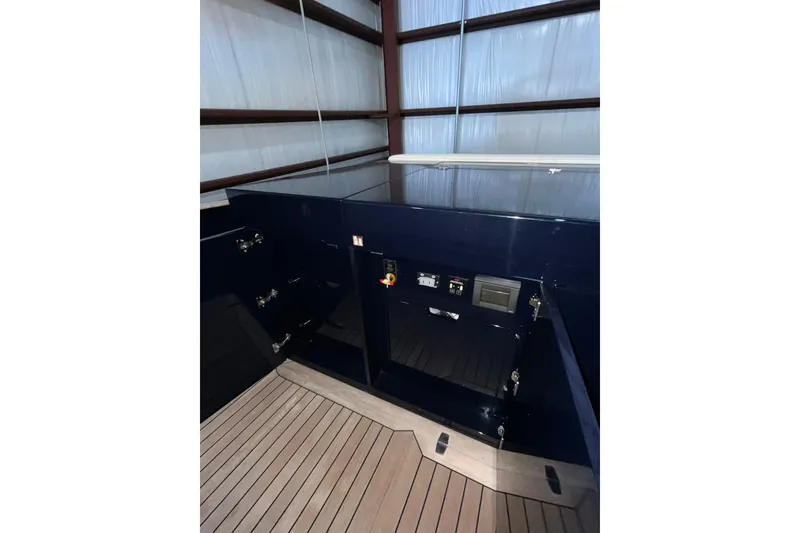 Slide: The Image of Interior of 2018 Alen 45 yacht with sleek cabinetry and wooden flooring. - 20