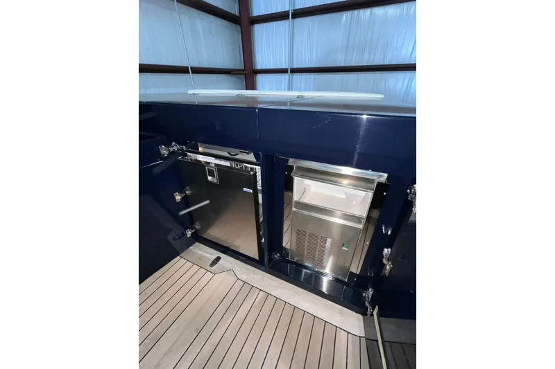 Slide: The Image of Luxury yacht Alen 45 (2018) interior with stainless steel appliances and wooden flooring. - 21