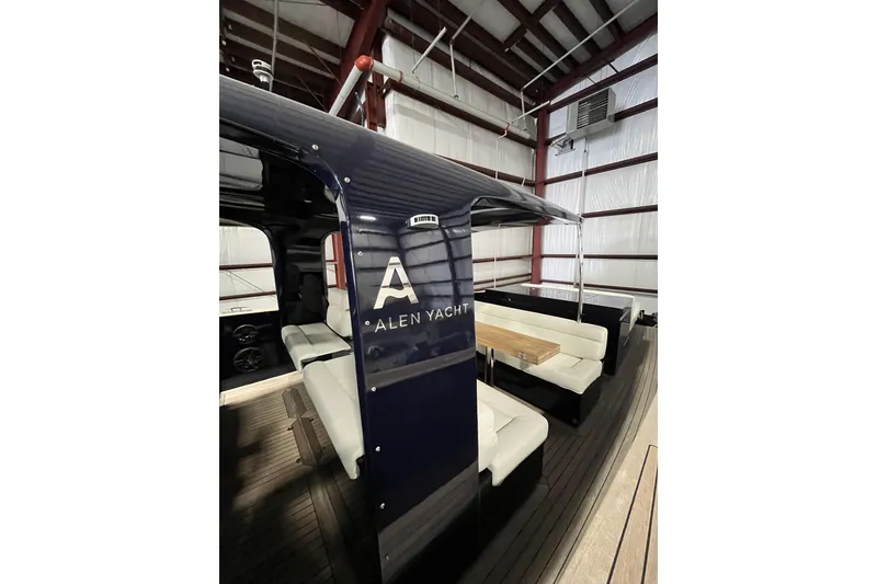 Slide: The Image of Luxurious 2018 Alen 45 yacht interior with elegant seating and wooden table. - 25
