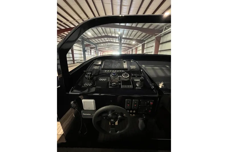 Slide: The Image of Control panel of a 2018 Alen 45 boat in a warehouse setting. - 28