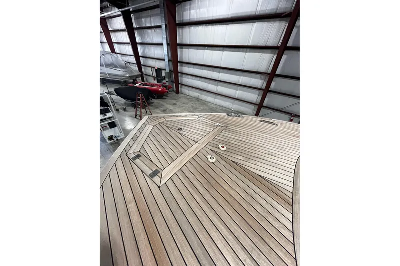 Slide: The Image of Wooden deck of a 2018 Alen 45 yacht in a storage facility. - 29