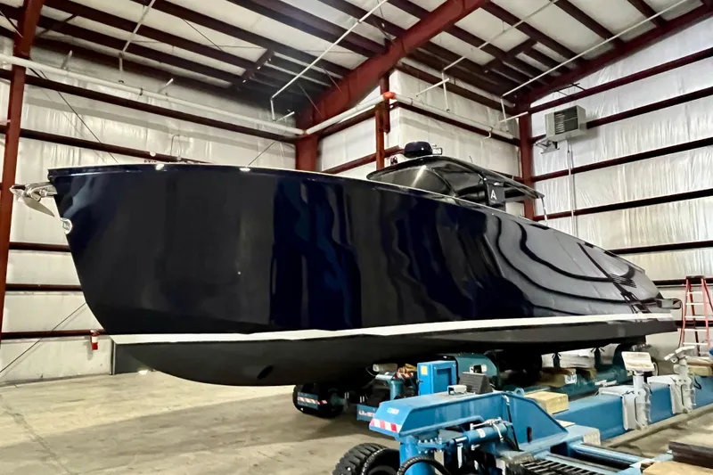Slide: The Image of Luxury Alen 45 yacht in a warehouse, 2018 model, sleek black design. - 3