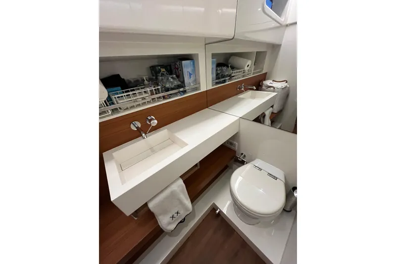 Slide: The Image of Modern bathroom interior on 2018 Alen 45 yacht, featuring sleek sink and toilet design. - 32