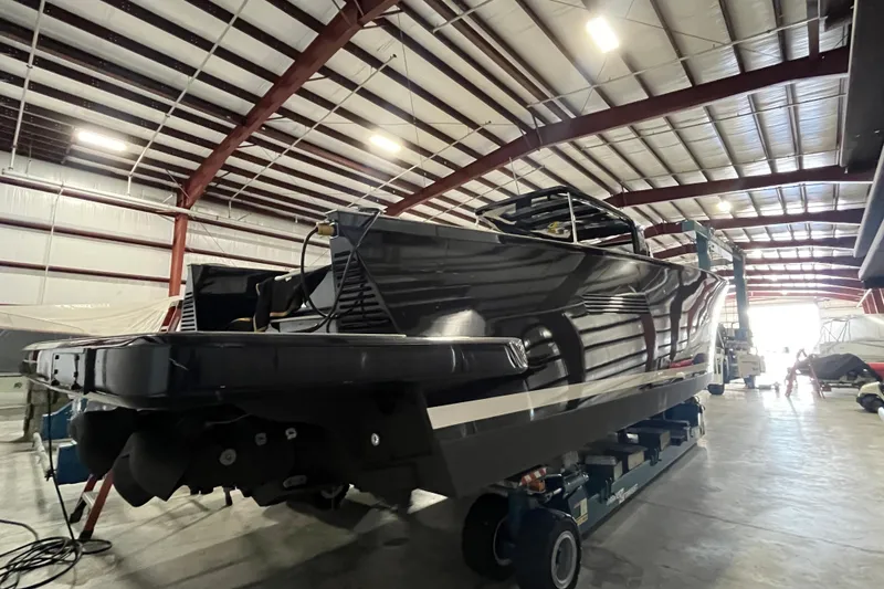 Slide: The Image of 2018 Alen 45 boat in a spacious indoor storage facility. - 35