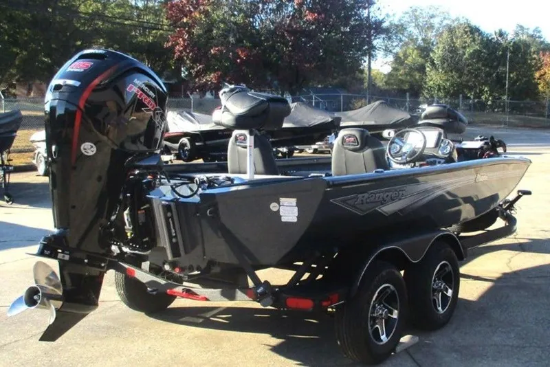 Slide: The Image of 2026 Ranger RT188P boat with powerful outboard motor, parked on a trailer. - 3