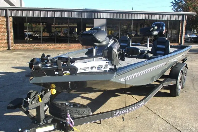 Slide: The Image of 2026 Ranger RT188P fishing boat on trailer, parked outside a building. - 6