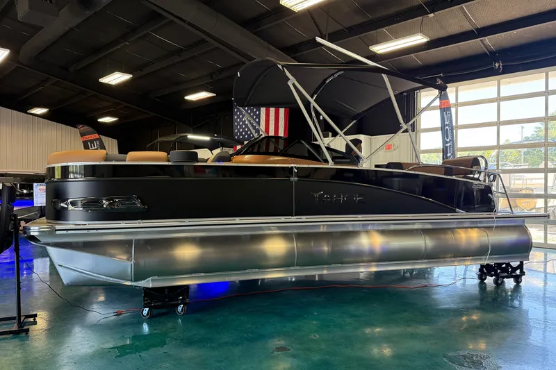The Image of 2026 Tahoe Pontoon Cascade Quad Lounger Shift Windshield in showroom, black exterior, under bright lights. - 0