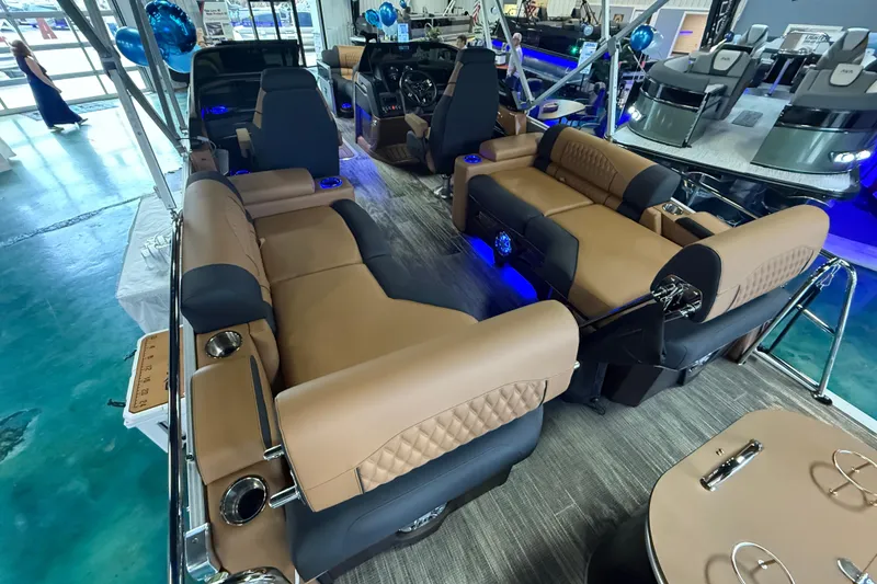 Slide: The Image of Luxurious interior of 2026 Tahoe Pontoon Cascade Quad Lounger with plush seating and ambient lighting. - 3