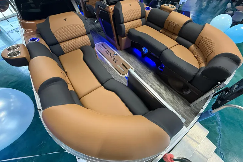 Slide: The Image of 2026 Tahoe Pontoon Cascade Quad Lounger with luxurious brown and black seating, blue LED lighting. - 7