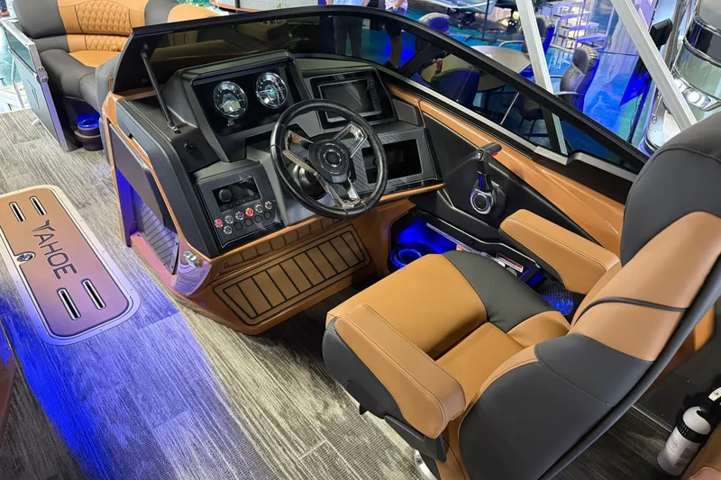Slide: The Image of 2026 Tahoe Pontoon Cascade Quad Lounger Shift Windshield interior with modern dashboard and seating. - 8