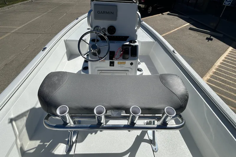 Slide: The Image of 2026 Avid 21 FST boat interior with Garmin navigation and rod holders. - 10