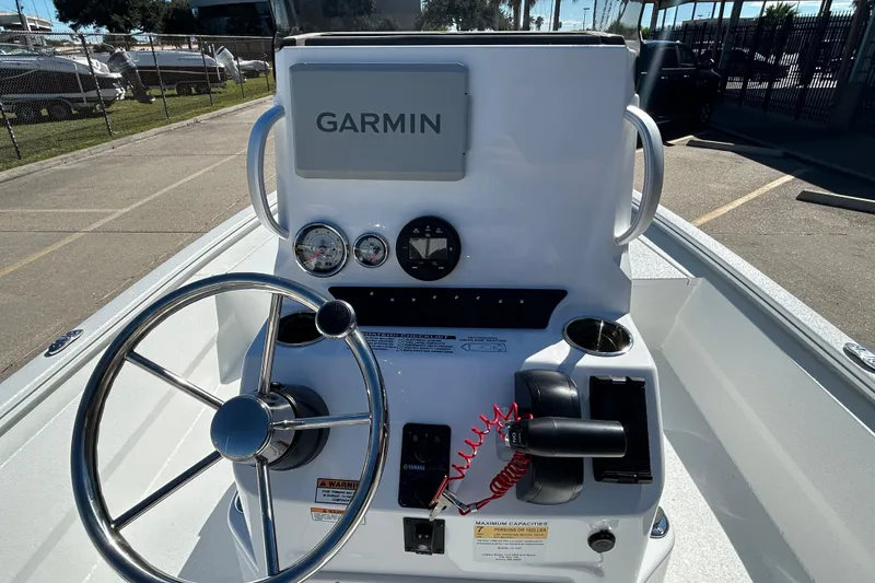 Slide: The Image of 2026 Avid 21 FST boat console with Garmin navigation and steering wheel. - 11