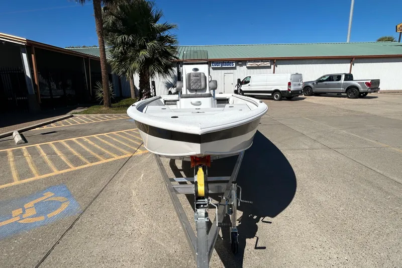 Slide: The Image of 2026 Avid 21 FST boat on trailer in parking lot, sunny day. - 2